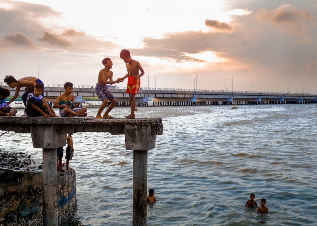 teenagers swimming as a group