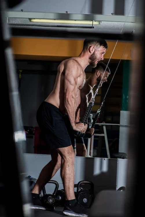 male swimmer keeping fitness using band swimmers workout