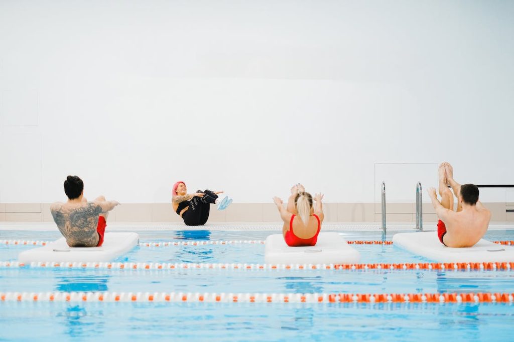 swimming competitors training together at a meet