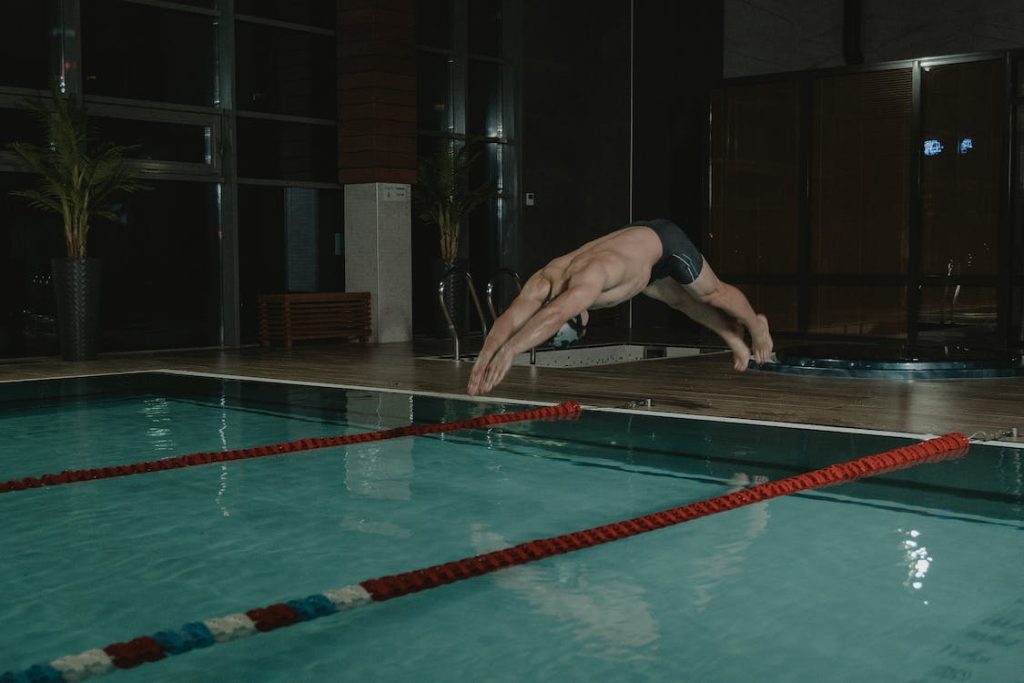 swimmer practicing the forward start used in swimming